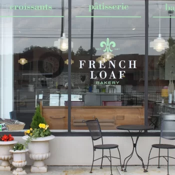 Photo taken of the French Loaf Bakery store showing the logo on the storefront window