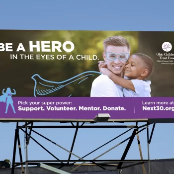 Billboard showing man & child as part of the Be A 30 Minute Hero Campaign.