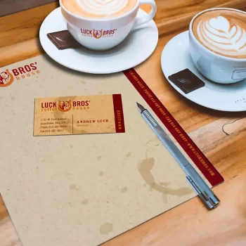 Luck Bros' Coffee House business card, menu, and coffee cup printed materials